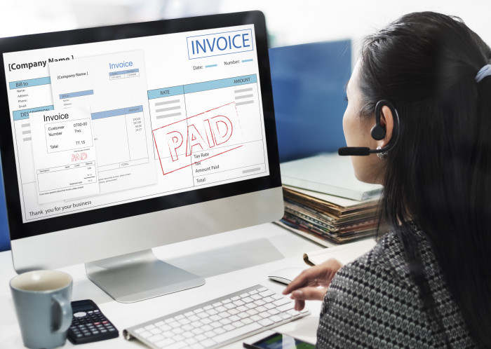 AP clerk manually processing invoices